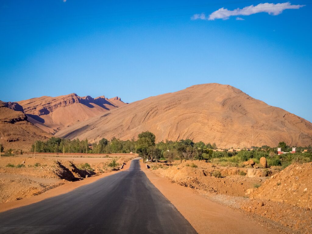 Private driver Marrakech day trip to Atlas Mountains Mercedes V-Class on mountain road with Berber village